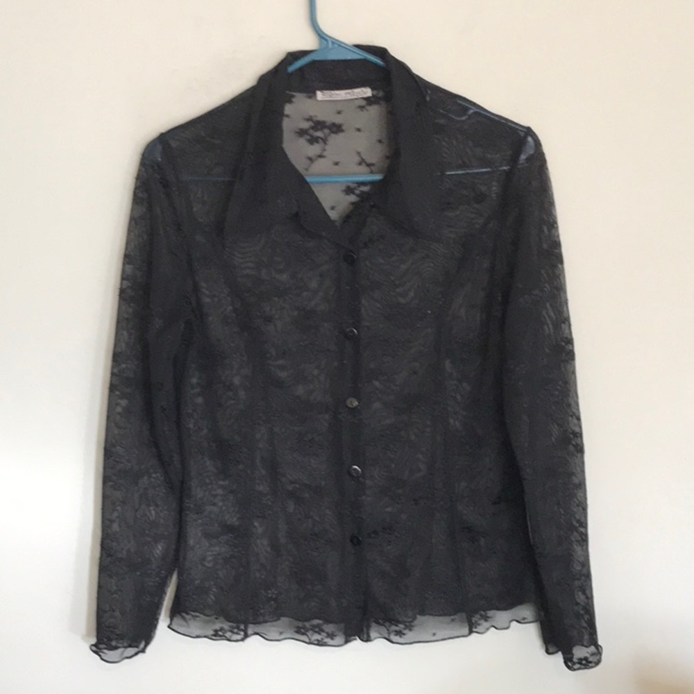 Beautiful sheer black ladies blouse with an embroidered floral pattern all over
